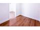 Bright bedroom featuring wood-look floors and a doorway to the next room at 3417 Bay Meadow Ct, Windermere, FL 34786