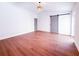 Spacious primary bedroom featuring hardwood floors, barn door closet, and modern lighting at 3417 Bay Meadow Ct, Windermere, FL 34786
