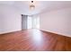 Spacious primary bedroom featuring hardwood floors, barn door closet, and sliding glass doors at 3417 Bay Meadow Ct, Windermere, FL 34786