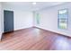 Bright bedroom boasts hardwood floors and plenty of natural light from two windows at 3417 Bay Meadow Ct, Windermere, FL 34786