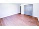 Bedroom featuring wood-look floors, base trim, and a grey closet at 3417 Bay Meadow Ct, Windermere, FL 34786