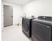 Laundry room features modern appliances, white cabinets, and a utility sink at 3417 Bay Meadow Ct, Windermere, FL 34786