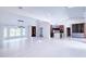 Bright living room boasts an open floor plan, modern lighting, tile floors and a seamless flow into the kitchen at 3417 Bay Meadow Ct, Windermere, FL 34786