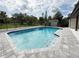 Backyard in-ground pool with paved surround, perfect for enjoying warm sunny days at 3417 Bay Meadow Ct, Windermere, FL 34786