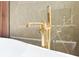 Close up on a modern golden freestanding tub faucet in the primary bathroom at 3417 Bay Meadow Ct, Windermere, FL 34786