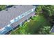 Aerial view of a backyard with a screened lanai, lush grass, and manicured landscaping at 3559 Victoria Pines Dr # 280, Orlando, FL 32829