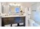 Bathroom featuring a marble countertop, a glass-enclosed shower, and stylish vanity at 3559 Victoria Pines Dr # 280, Orlando, FL 32829