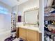 Well-lit bathroom with vanity, large mirror, and combined shower and tub at 3559 Victoria Pines Dr # 280, Orlando, FL 32829