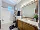 Bathroom with shower, vanity, and tile flooring and is nicely decorated at 3559 Victoria Pines Dr # 280, Orlando, FL 32829