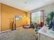 Bedroom with tan accent wall, carpet, natural light and creative decor elements at 3559 Victoria Pines Dr # 280, Orlando, FL 32829
