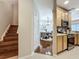 Inviting entryway featuring a staircase and dining area with stylish chandelier and wooden floors at 3559 Victoria Pines Dr # 280, Orlando, FL 32829