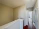 Hallway features hardwood floors, neutral paint, and doorway into bedroom at 3559 Victoria Pines Dr # 280, Orlando, FL 32829
