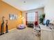 Stylish home office featuring a comfortable office chair, ample workspace, and bright accent wall at 3559 Victoria Pines Dr # 280, Orlando, FL 32829