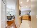 Open-concept living space with hardwood floors, dining area, and stainless steel kitchen appliances at 3559 Victoria Pines Dr # 280, Orlando, FL 32829