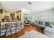 Open-concept living space featuring a kitchen, dining area, and living room with modern decor at 3559 Victoria Pines Dr # 280, Orlando, FL 32829