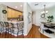 Spacious open floor plan featuring kitchen with bar seating, and a view to the dining area at 3559 Victoria Pines Dr # 280, Orlando, FL 32829