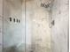 Modern bathroom featuring a stand up shower with marble tiling, shower head, and gray tile flooring at 3559 Victoria Pines Dr # 280, Orlando, FL 32829