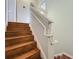View of the beautiful wood staircase with white trim and walls in a two-story home at 3559 Victoria Pines Dr # 280, Orlando, FL 32829