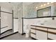 Bathroom featuring patterned wallpaper, white tiling, and modern sink and toilet at 3716 Neptune Dr, Orlando, FL 32804