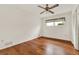 This bedroom features hardwood floors, a ceiling fan, and a window at 3716 Neptune Dr, Orlando, FL 32804