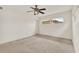 Bright bedroom with neutral carpet, ceiling fan, and natural light at 3716 Neptune Dr, Orlando, FL 32804