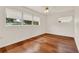 Bright bedroom with hardwood floors, ceiling fan, and natural light at 3716 Neptune Dr, Orlando, FL 32804