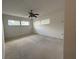 Cozy bedroom featuring neutral walls, carpet, and natural light from the window at 3716 Neptune Dr, Orlando, FL 32804