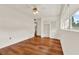 Bright bedroom with hardwood floors, ceiling fan, and closet at 3716 Neptune Dr, Orlando, FL 32804