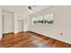 Bright bedroom with hardwood floors, ceiling fan, and closet at 3716 Neptune Dr, Orlando, FL 32804