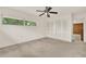 A bedroom featuring a ceiling fan, a window view with outdoor light, and closet space at 3716 Neptune Dr, Orlando, FL 32804