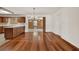 Open dining area with hardwood floors, a chandelier, and easy access to the kitchen and backyard at 3716 Neptune Dr, Orlando, FL 32804