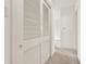 Hallway showcasing closet doors with a view of the carpeted floor at 3716 Neptune Dr, Orlando, FL 32804