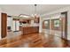 Cozy eat-in kitchen with dark wood cabinets and sliding glass doors to the back patio at 3716 Neptune Dr, Orlando, FL 32804