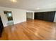 Spacious living room featuring hardwood floors, and a built-in wall bookshelf at 3716 Neptune Dr, Orlando, FL 32804