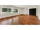 Bright living room featuring beautiful hardwood floors and large windows with lots of natural light at 3716 Neptune Dr, Orlando, FL 32804
