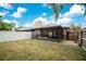 Spacious fenced backyard with a screened-in porch, offering privacy and outdoor enjoyment at 378 Cedarbrook Ln, Altamonte Springs, FL 32714