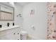 Bright bathroom with white vanity, black hardware, and modern fixtures at 378 Cedarbrook Ln, Altamonte Springs, FL 32714