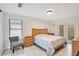 Light and airy bedroom featuring neutral walls, modern furnishings, and natural light at 378 Cedarbrook Ln, Altamonte Springs, FL 32714