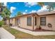 Beige one-story home featuring a walkway to the front door at 378 Cedarbrook Ln, Altamonte Springs, FL 32714