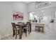 An eat-in kitchen featuring a dark wood table, white cabinets, and light gray floors at 378 Cedarbrook Ln, Altamonte Springs, FL 32714