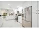 Bright kitchen with white cabinets, stainless steel appliances, and an eat-in bar at 378 Cedarbrook Ln, Altamonte Springs, FL 32714
