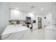 Bright, renovated kitchen with white cabinets, stainless appliances, and marble countertops at 378 Cedarbrook Ln, Altamonte Springs, FL 32714