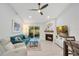 Bright living room with a fireplace, fan, light gray floors, and glass sliding doors at 378 Cedarbrook Ln, Altamonte Springs, FL 32714