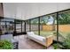 Inviting sunroom with tiled floor and comfortable seating overlooking fenced yard at 378 Cedarbrook Ln, Altamonte Springs, FL 32714
