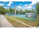 Well-maintained community tennis courts with surrounding landscaping, perfect for recreation at 378 Cedarbrook Ln, Altamonte Springs, FL 32714