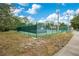 Community tennis courts surrounded by lush trees and greenery at 378 Cedarbrook Ln, Altamonte Springs, FL 32714