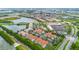 An aerial view showcasing an expansive community with multiple buildings, water features, and retail areas at 4001 Breakview Dr # D409, Orlando, FL 32819