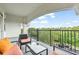 Relaxing balcony with seating, offering serene views of lush greenery and blue skies at 4001 Breakview Dr # D409, Orlando, FL 32819