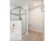 Clean bathroom featuring a shower with glass door and a separate bathtub at 4001 Breakview Dr # D409, Orlando, FL 32819