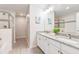 Elegant bathroom with double sinks, granite countertops, and a glass-enclosed shower at 4001 Breakview Dr # D409, Orlando, FL 32819